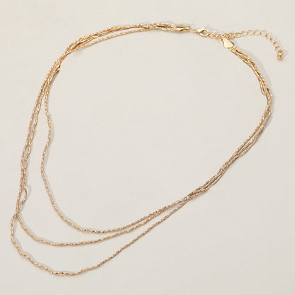 Madeline Love Gold Triple Layered Brass Chain Necklace