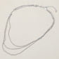 Madeline Love Rhodium Triple Layered Brass Chain Necklace