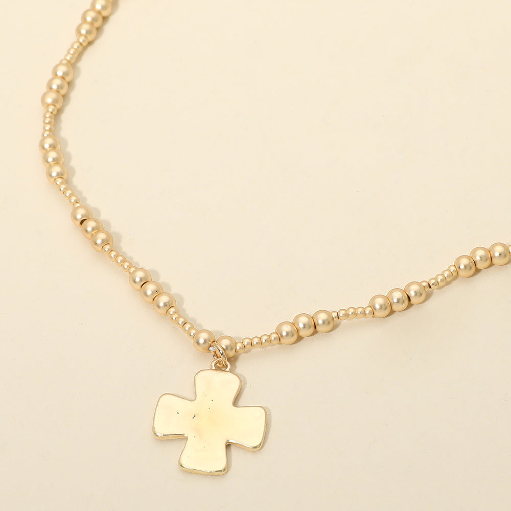 Madeline Love Gold Brushed Hammered Metal Cross Pendant Beaded Chain Necklace - Necklaces