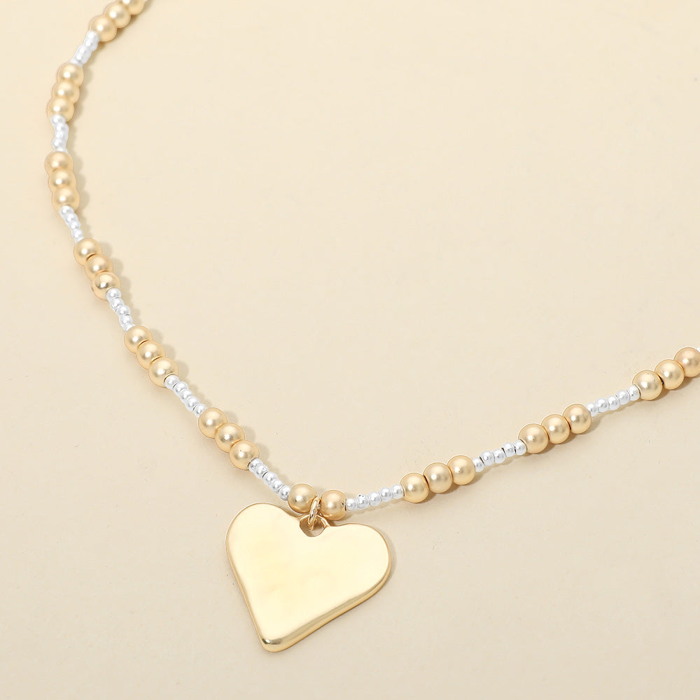 Madeline Love Gold, Silver, Two Tone Brushed Hammered Metal Heart Pendant Beaded Chain Necklace - Necklaces
