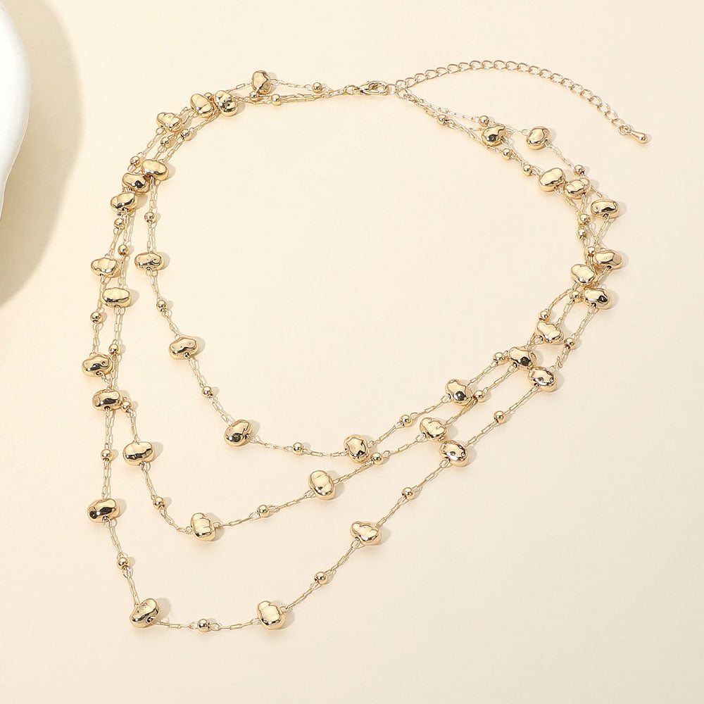 Madeline Love Gold Irregular Metal Pebble Beaded Station Triple Layered Necklace