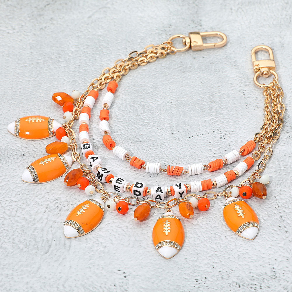 Madeline Love Gold, Orange, White Football Charm Embellished GAME DAY Heishi Beaded Layered Bag Charm - Bags & Wallets