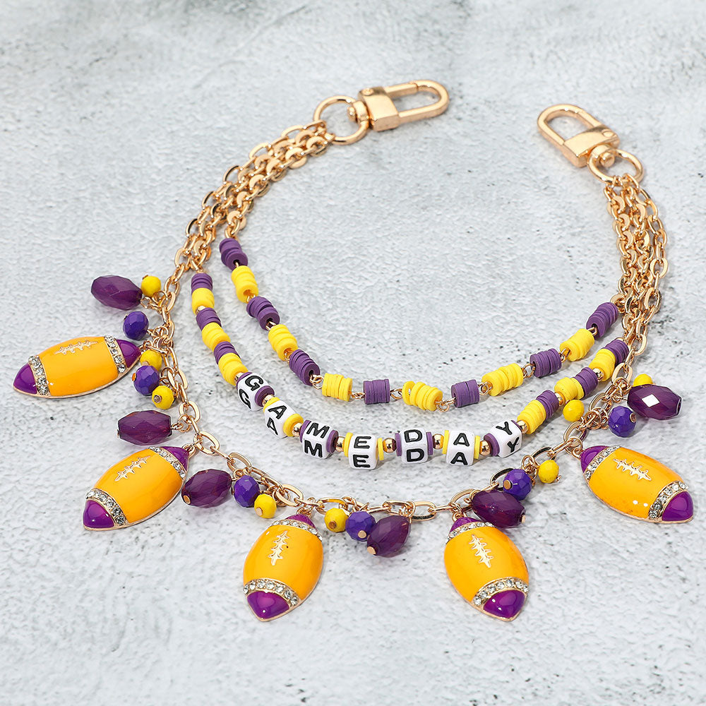 Madeline Love Gold, Purple , Yellow Football Charm Embellished GAME DAY Heishi Beaded Layered Bag Charm - Bags & Wallets