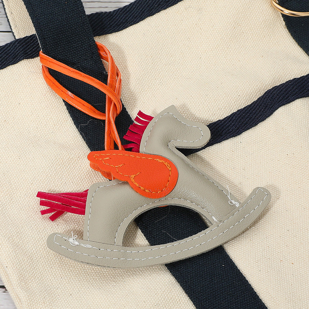 Madeline Love Gray Faux Leather Winged Rocking Horse Bag Charm - Bags & Wallets