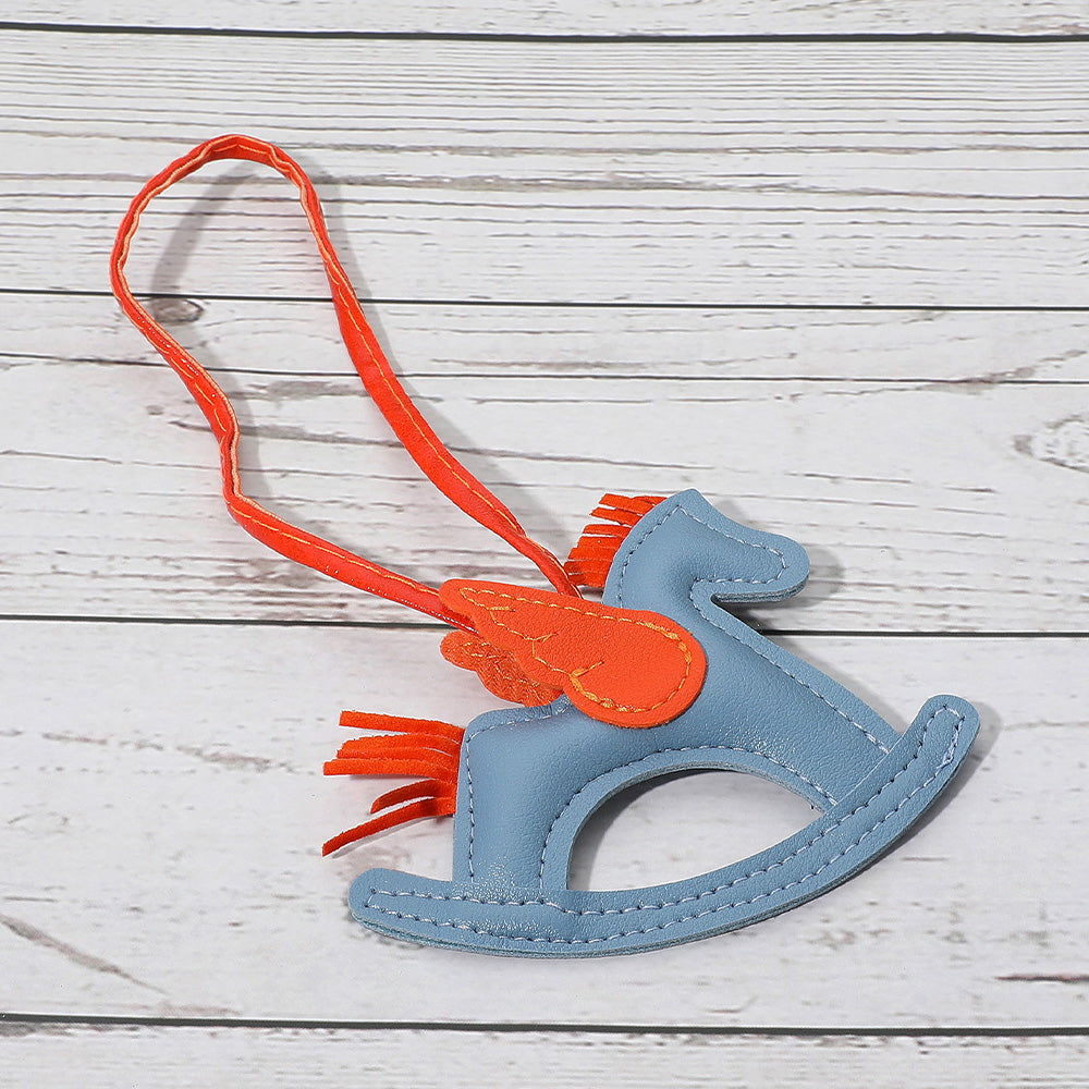 Madeline Love Light Blue Faux Leather Winged Rocking Horse Bag Charm - Bags & Wallets