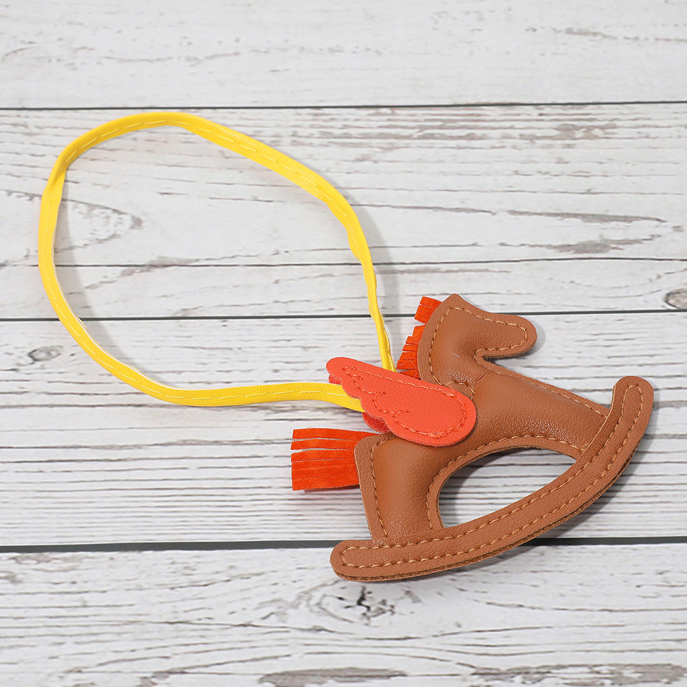 Madeline Love Neutral Faux Leather Winged Rocking Horse Bag Charm - Bags & Wallets