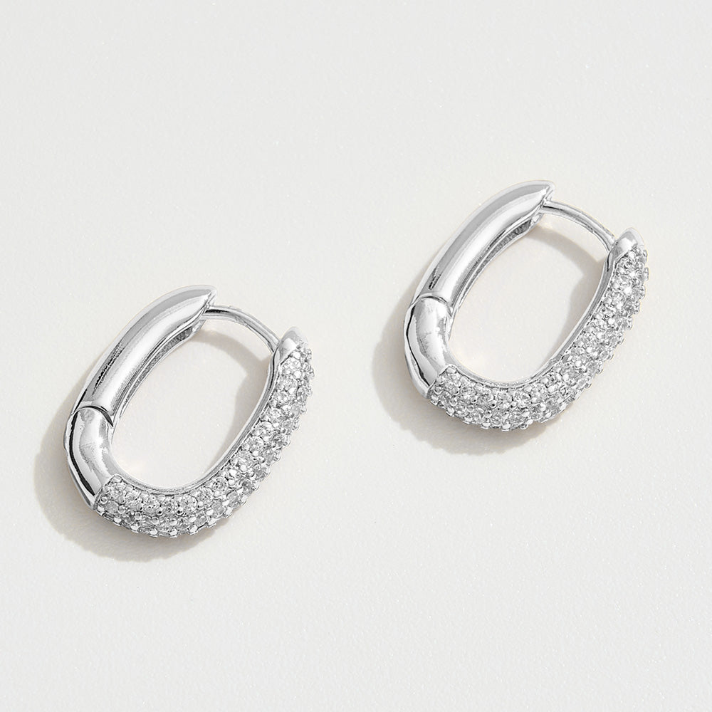 Madeline Love Silver White Gold Dipped CZ Stone Paved Oval Huggie Hoop Earrings