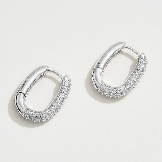 Madeline Love Silver White Gold Dipped CZ Stone Paved Oval Huggie Hoop Earrings