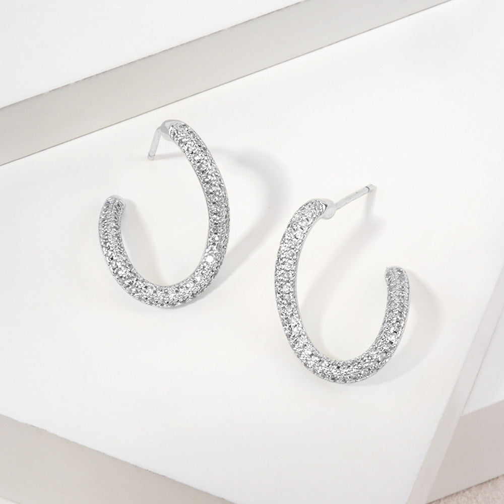 Madeline Love Clear, Rhodium 14K Gold Dipped CZ Pave Sculptural Curved Hoop Earrings