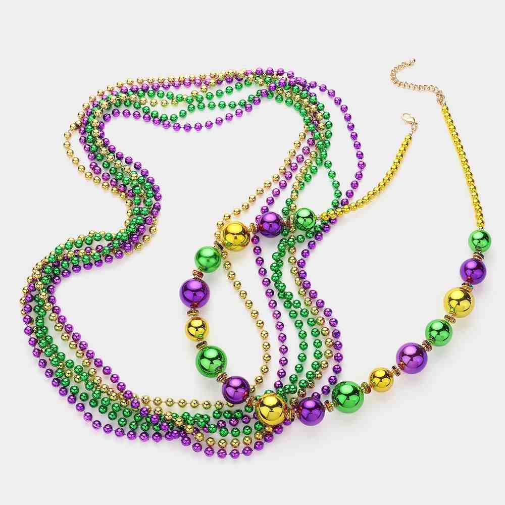 Mardi Gras Ball Beaded Layered Necklace is expertly crafted to deliver a festive and elegant look. Featuring vibrant beads and a stylish layered design, it brings a playful touch to any outfit. Perfect for Mardi Gras celebrations, this necklace is a must-have for party-goers seeking standout accessories.