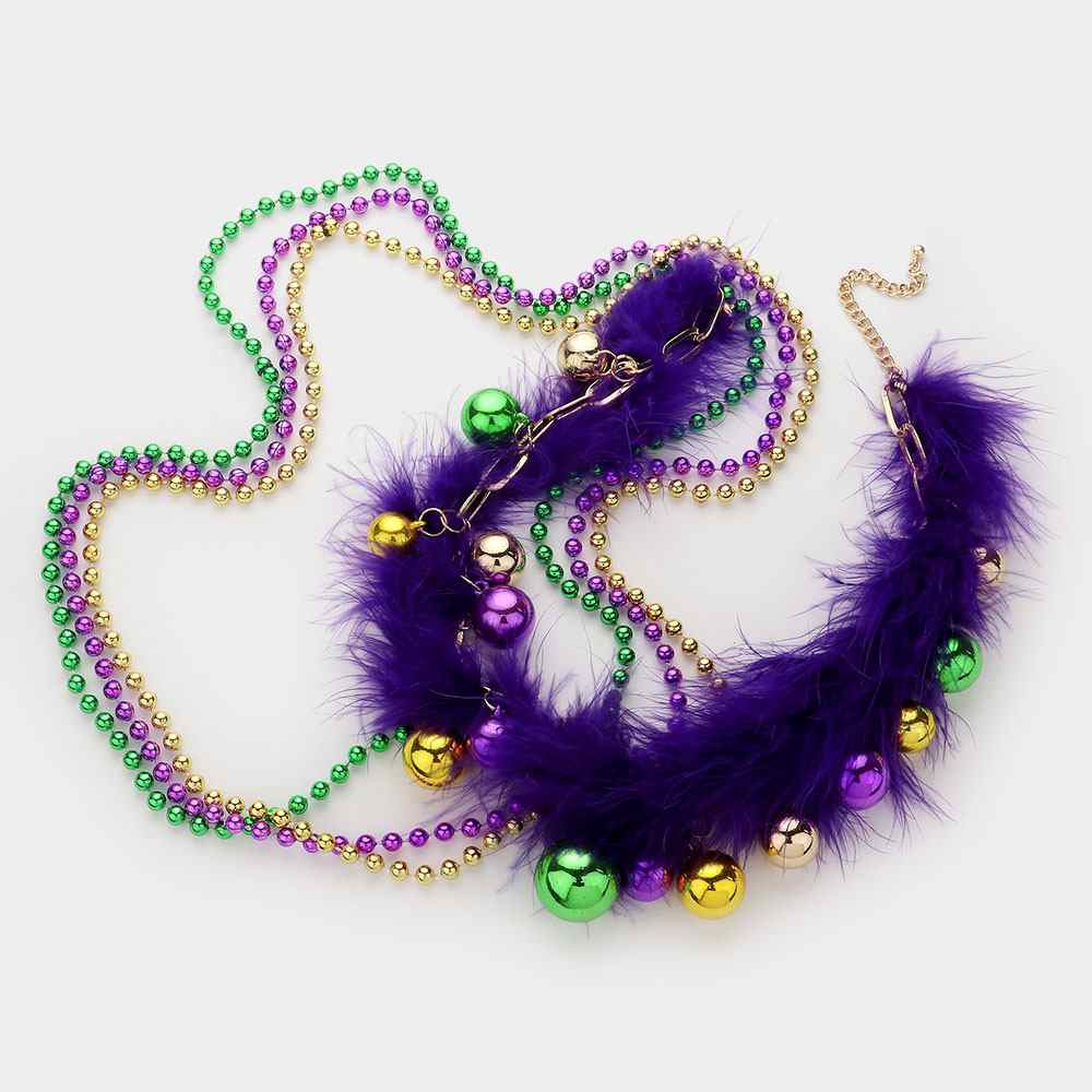 Mardi Gras Feather Ball Beaded Layered Necklace is the perfect accessory for your next festive celebration. Featuring vibrant beads and playful feather accents, this necklace brings fun and flair to any outfit. The layered design adds depth and dimension, making it a true standout piece. Turn heads and elevate your look with this unique Mardi Gras necklace.