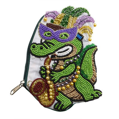 Multi Festive zipper pouch featuring a playful alligator character inspired by Mardi Gras celebration themes. Designed for storing cosmetics, coins, keys, or small accessories, this novelty pouch adds fun personality to seasonal collections, party assortments, gift shops, and festival-focused retail displays while offering practical everyday organization.
