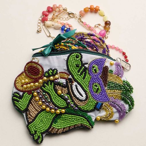Multi Festive zipper pouch featuring a playful alligator character inspired by Mardi Gras celebration themes. Designed for storing cosmetics, coins, keys, or small accessories, this novelty pouch adds fun personality to seasonal collections, party assortments, gift shops, and festival-focused retail displays while offering practical everyday organization.