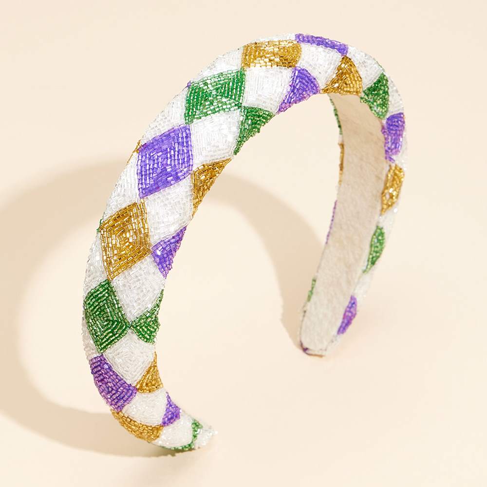 Mardi Gras Seed Beaded Headband is a must-have accessory for festive celebrations. Crafted with vibrant, colorful beads in traditional Mardi Gras hues, it adds a touch of fun and flair to any outfit. Ideal for parades, parties, and other special occasions, it’s perfect for elevating your festive style. 