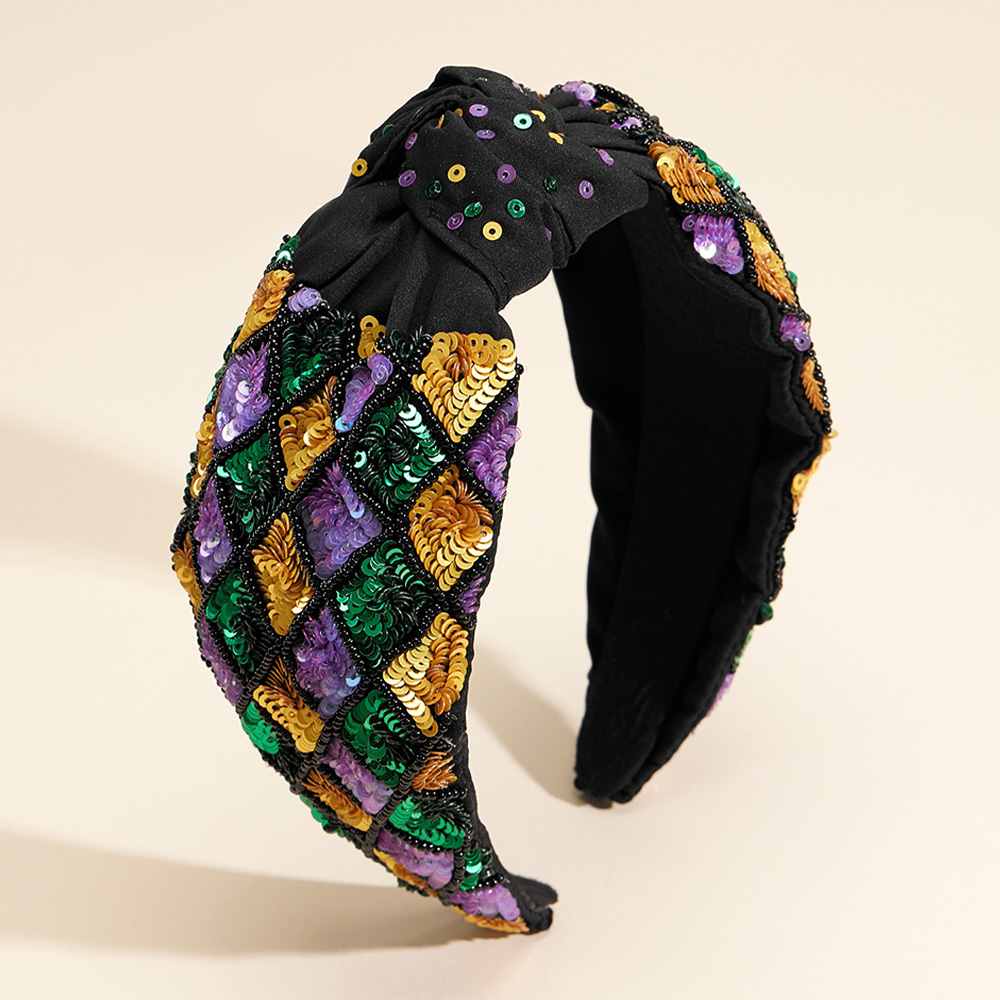 Mardi Gras Sequin Embellished Knot Headband brings a touch of sparkle to your festive attire. Designed with a vibrant color palette and intricate sequin embellishments, it’s an ideal accessory for Mardi Gras celebrations. The comfortable knot design ensures the headband stays securely in place, letting you party in style all day long.