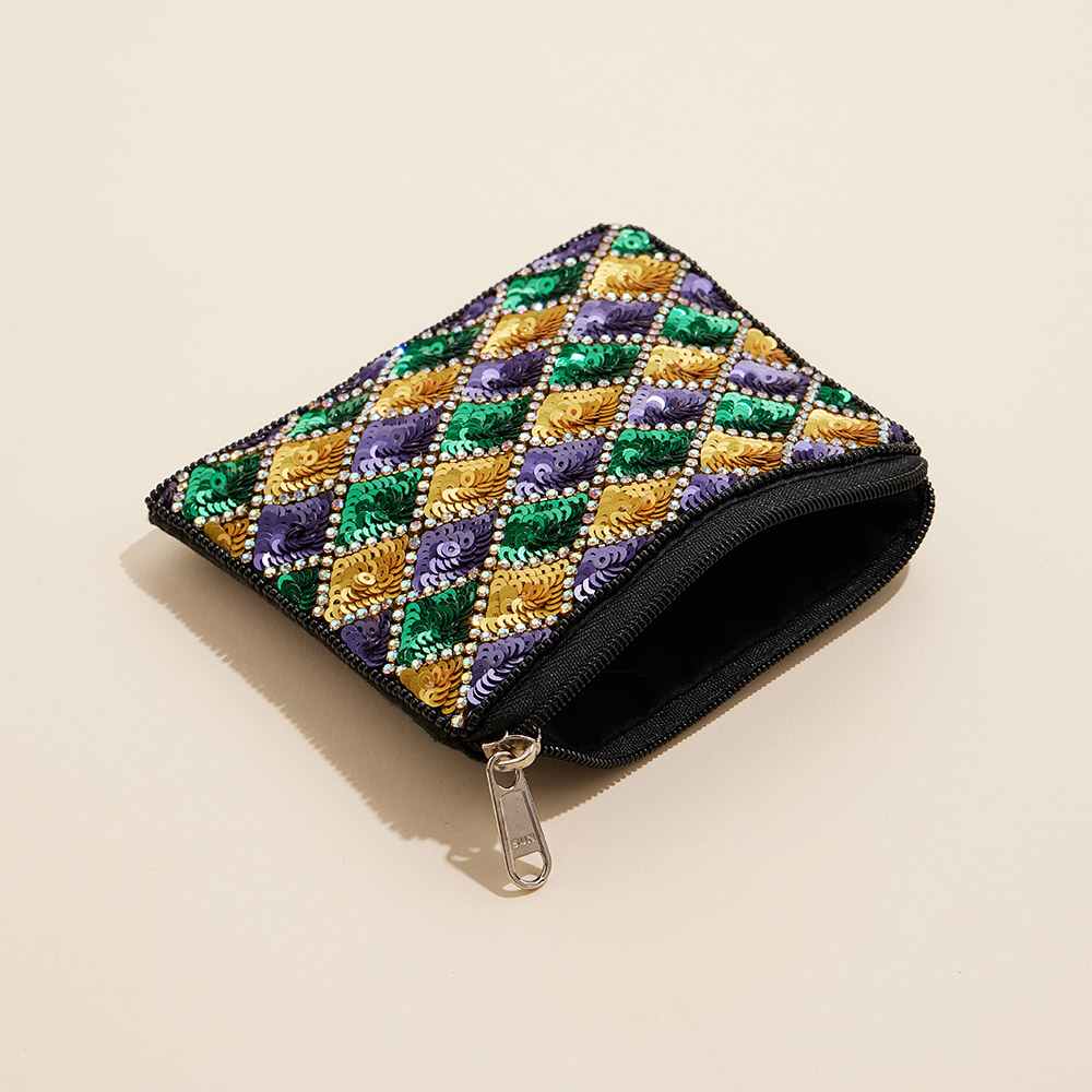 Mardi Gras Sequin Stone Beaded Mini Pouch Bag is a stylish and festive accessory for any occasion. Intricate sequin and stone beading add a touch of flair, while the compact size makes it ideal for carrying essentials on the go. Elevate your outfit and celebrate in style with this mini pouch bag.