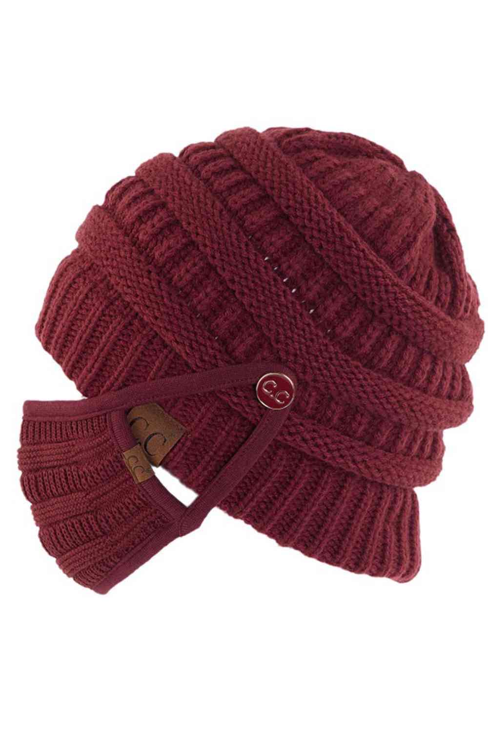 Maroon Stay warm and functional with this C.C Ribbed Knit Beanie featuring a convenient button attachment for your mask. Crafted from 100% acrylic, this lightweight beanie offers soft comfort and durability for everyday wear.