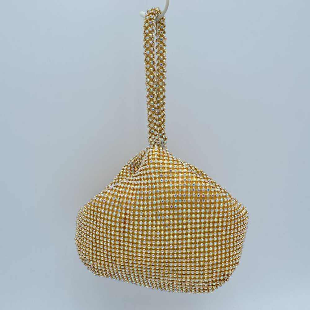 Matte Gold Make a bold yet elegant statement with the shimmering evening pouch. Perfect for nights out, formal dinners, or special events, this unique wristlet infuses any outfit with instant texture and subtle sparkle.