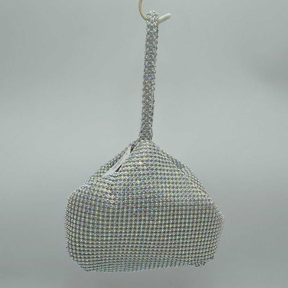Matte Silver Make a bold yet elegant statement with the shimmering evening pouch. Perfect for nights out, formal dinners, or special events, this unique wristlet infuses any outfit with instant texture and subtle sparkle.