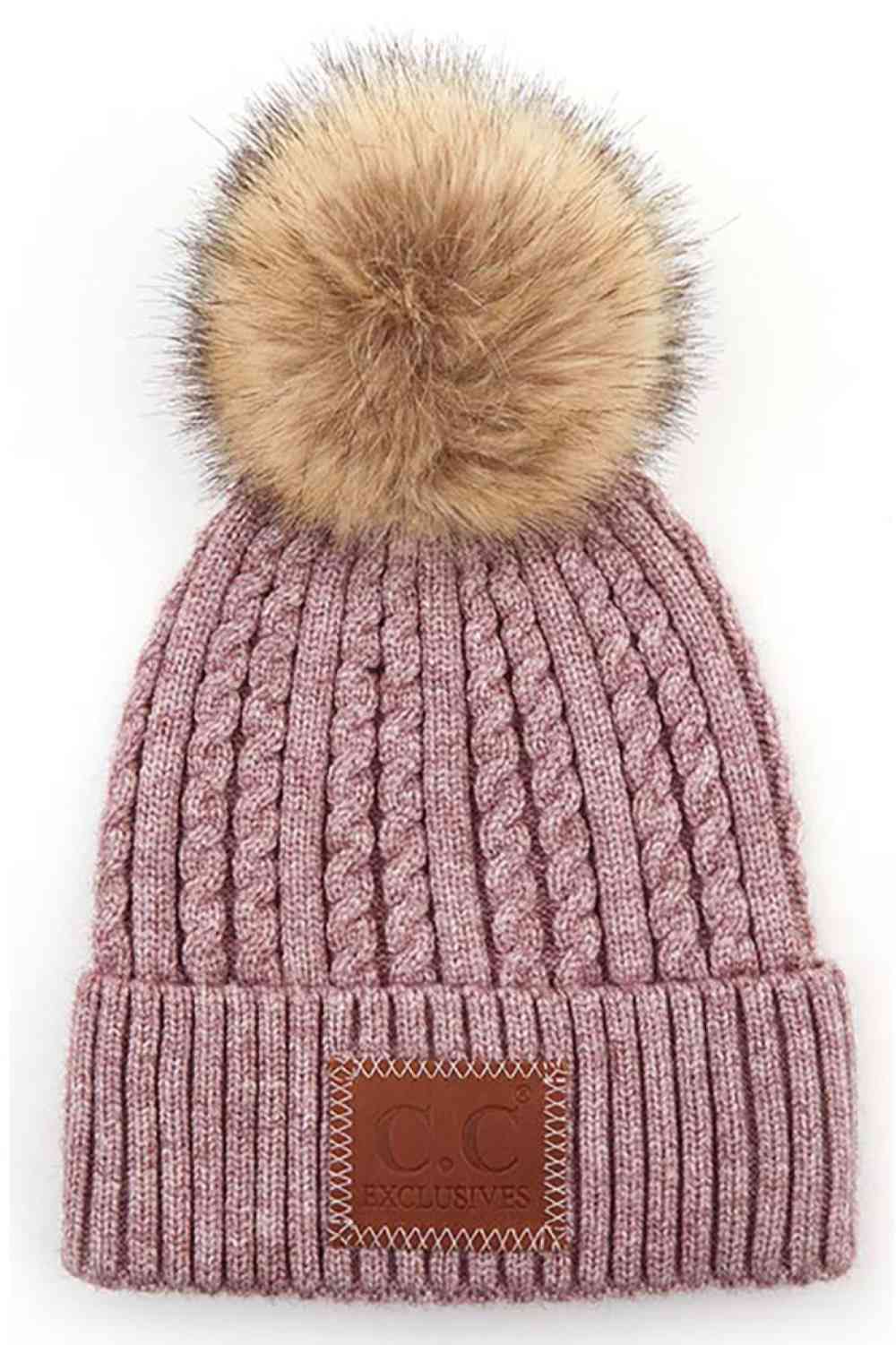 Mauve Stay warm and stylish with the C.C Double Braided Beanie, featuring a cozy pom-pom and iconic C.C leather patch. Crafted from a durable blend of 75% acrylic and 25% nylon, this beanie offers comfort and longevity through every season.