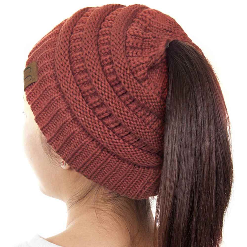 Mauve The C.C Solid Color Ponytail Messy Bun Beanie combines comfort with versatility for effortless everyday style. Crafted from 100% soft acrylic, this beanie features an open crown design that accommodates ponytails and messy buns while keeping you warm. The one-size-fits-most construction ensures a secure, flattering fit for virtually anyone. Perfect for casual outings, workouts, or relaxed weekends, this practical accessory transitions seamlessly from season to season.