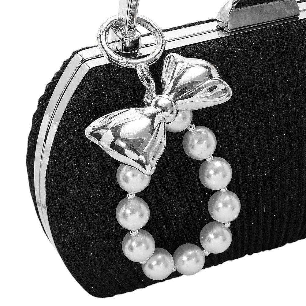 Cream Rhodium Metal Bow Pearl Beaded Keychain / Bag Charm adds a touch of sophistication to your keys or bag. Made with high-quality metal and adorned with faux pearls, it brings a stylish flair to any accessory. Perfect for adding a touch of glamour to your everyday essentials. 