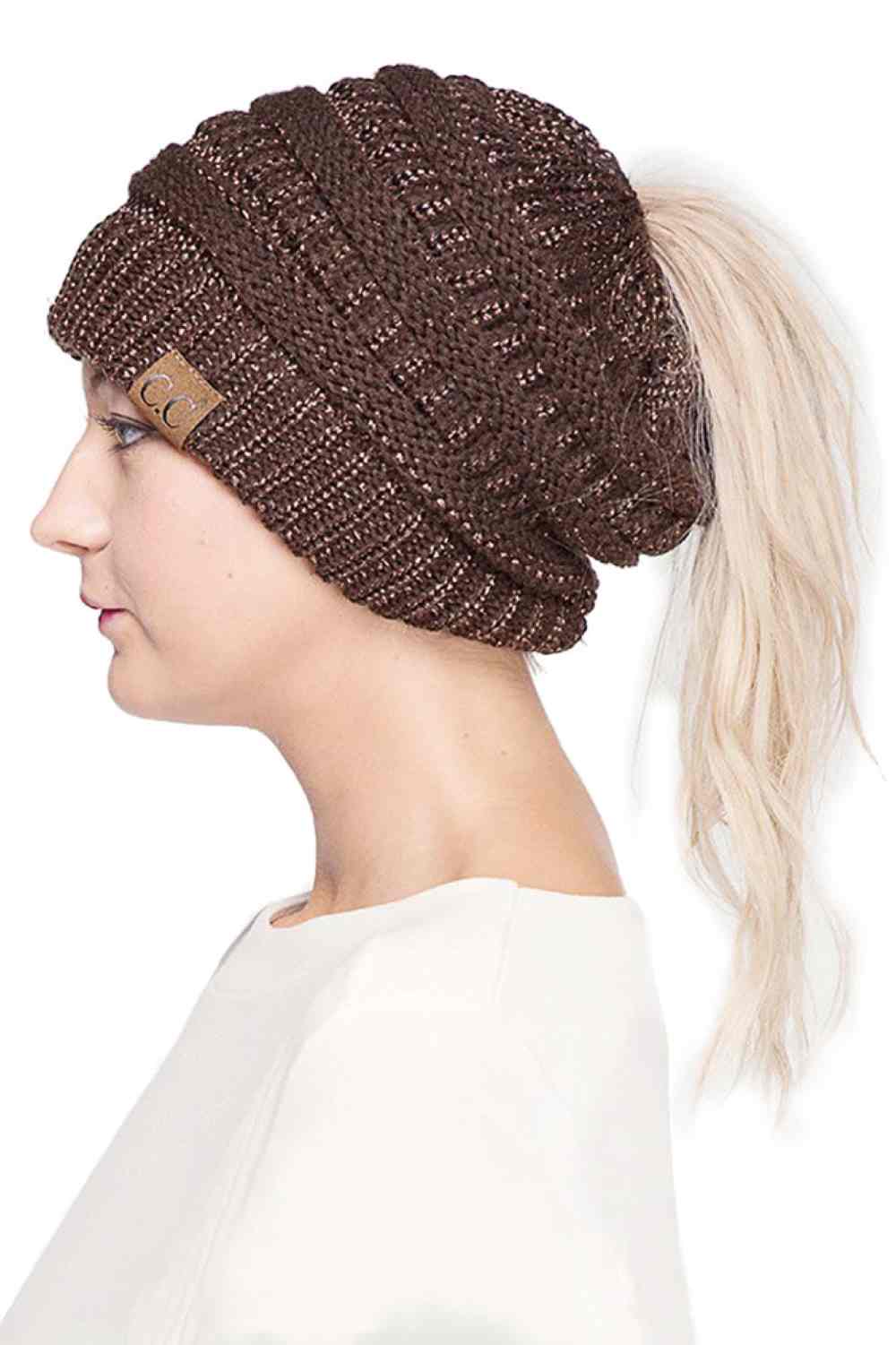 Brown Stay cozy and stylish with the C.C Metallic Messy Bun Ponytail Beanie, designed for effortless everyday wear. Crafted from 100% acrylic, this lightweight beanie features a sleek metallic finish that adds a modern touch to any outfit.