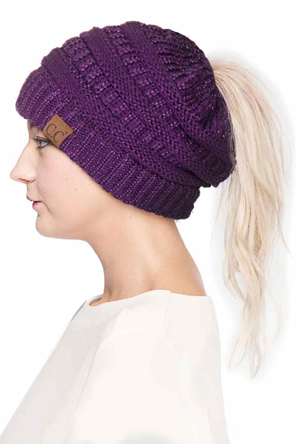 Purple Stay cozy and stylish with the C.C Metallic Messy Bun Ponytail Beanie, designed for effortless everyday wear. Crafted from 100% acrylic, this lightweight beanie features a sleek metallic finish that adds a modern touch to any outfit.