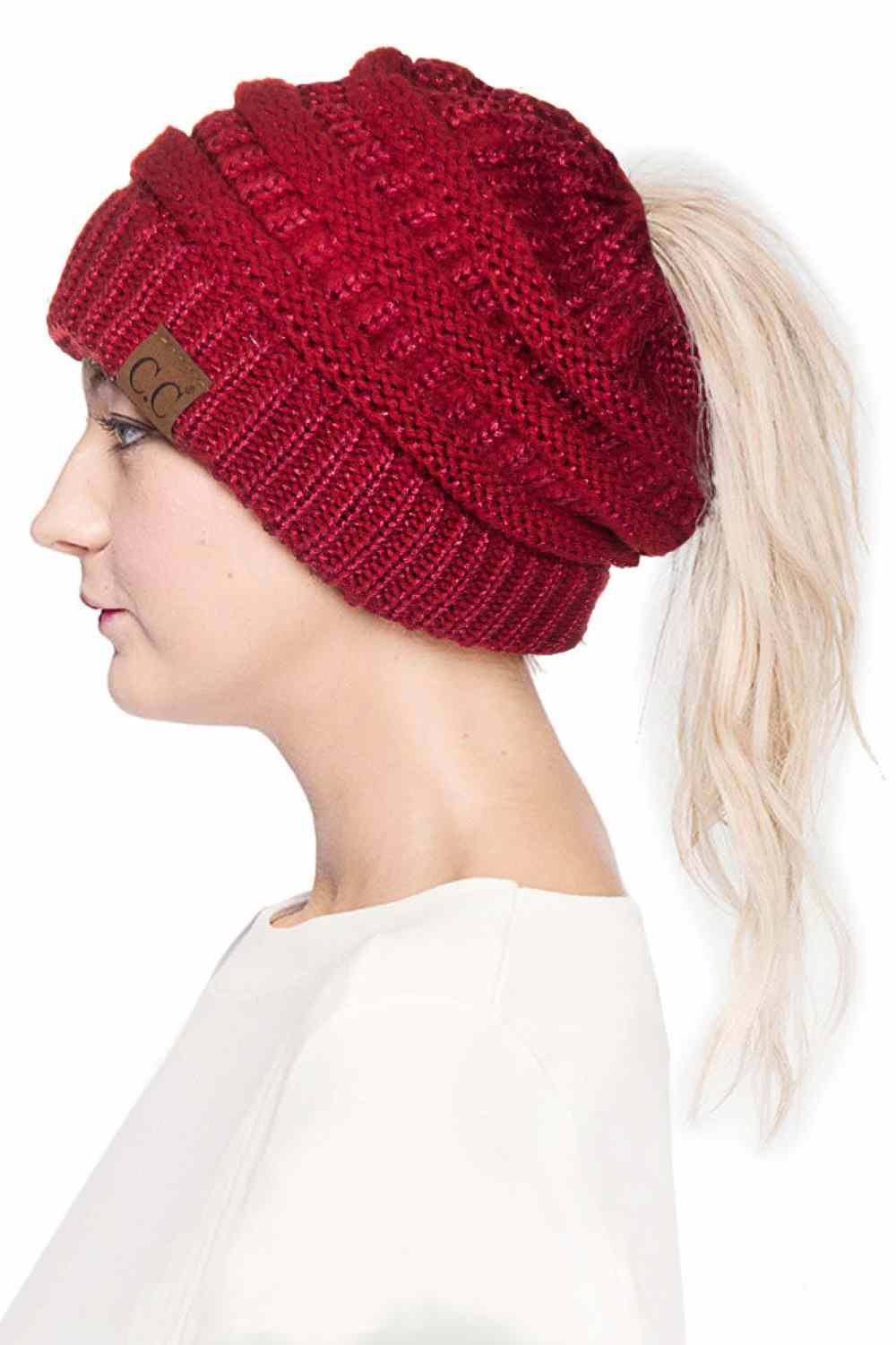 Red Stay cozy and stylish with the C.C Metallic Messy Bun Ponytail Beanie, designed for effortless everyday wear. Crafted from 100% acrylic, this lightweight beanie features a sleek metallic finish that adds a modern touch to any outfit.