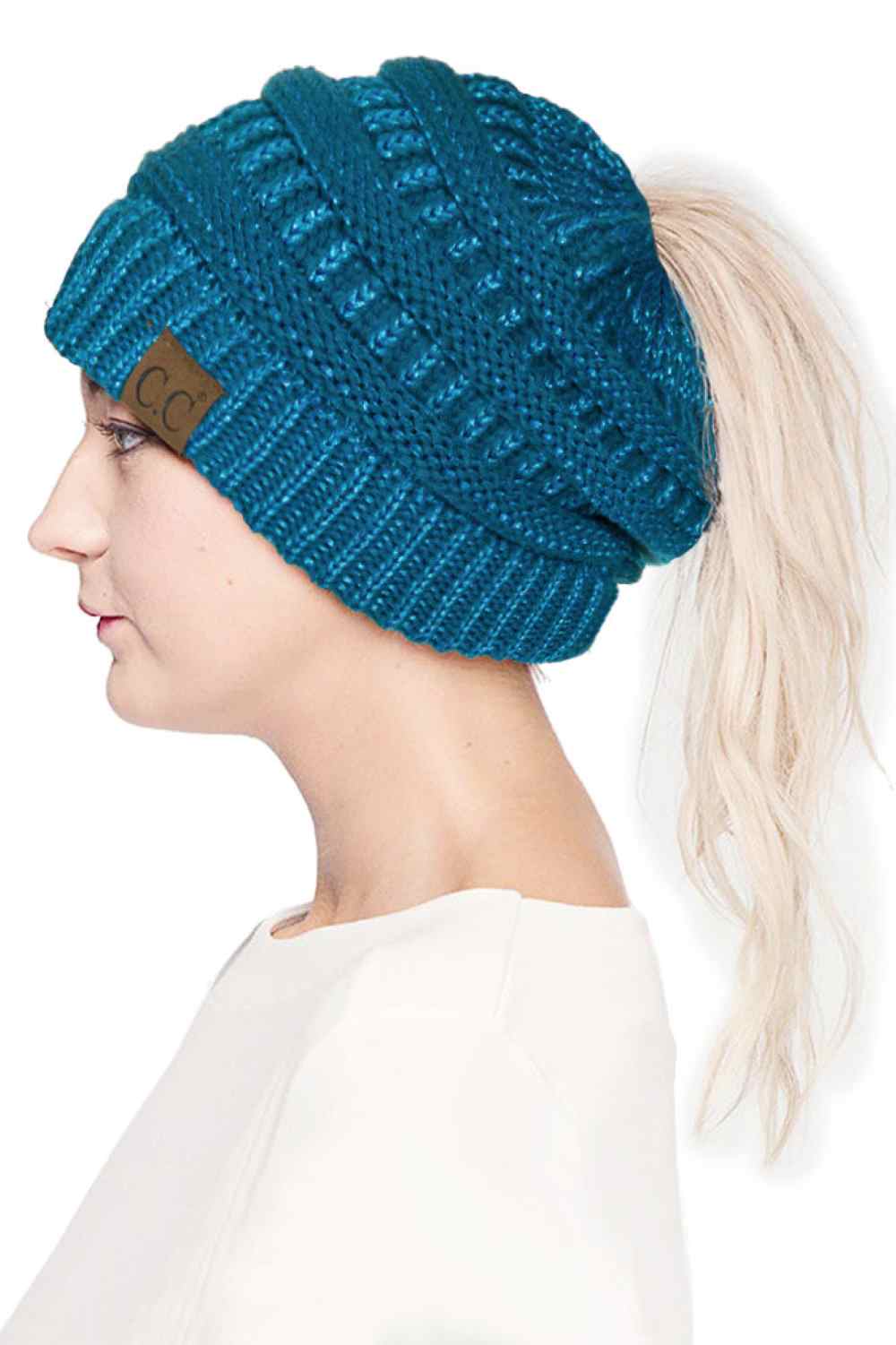 Teal Stay cozy and stylish with the C.C Metallic Messy Bun Ponytail Beanie, designed for effortless everyday wear. Crafted from 100% acrylic, this lightweight beanie features a sleek metallic finish that adds a modern touch to any outfit.