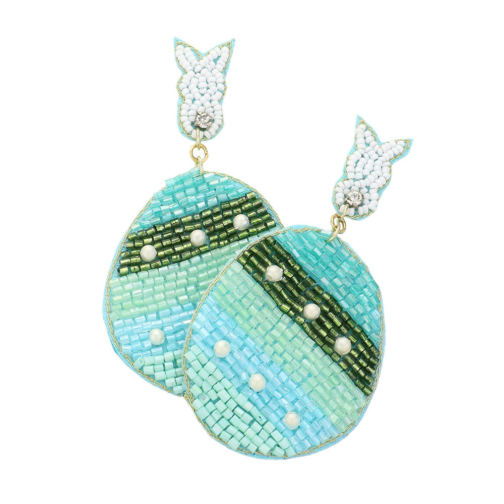 Mint- Felt Back Beaded Easter Bunny Egg Link Dangle Earrings are a festive addition to any Easter outfit. The unique design features a felt backing and delicate beaded details, providing a touch of whimsy and charm. These earrings are perfect for adding a fun and playful touch to your holiday look. 