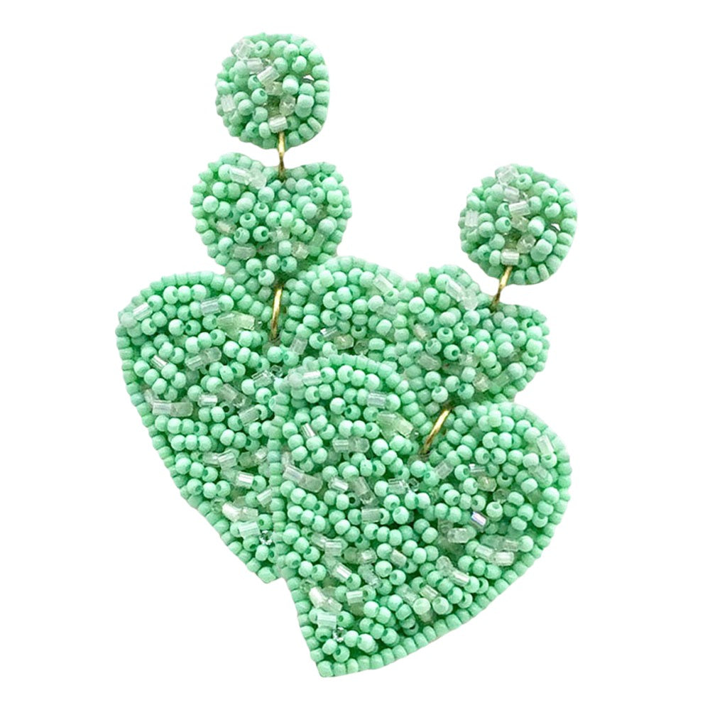 Mint Felt Back Seed Beaded Heart Link Dangle Earrings are perfect for adding a touch of elegance to any outfit. Handcrafted with intricate seed bead detailing, the felt backing adds a unique texture and depth to the design. Lightweight and comfortable to wear, these earrings are a stylish addition to any jewelry collection.