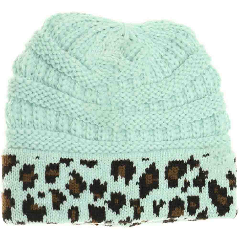 Mint Kids Matching Cuff Leopard Print CC Beanie combines playful style with cozy warmth. Crafted from a soft knit fabric, this piece features a trendy leopard print pattern and a folded cuff accented by the classic CC logo. Ideal for chilly days, it keeps little heads comfortable while adding a fashionable touch to any outfit. Perfect for matching with adult styles, this beanie offers both practicality and a chic edge for young fashion enthusiasts. 