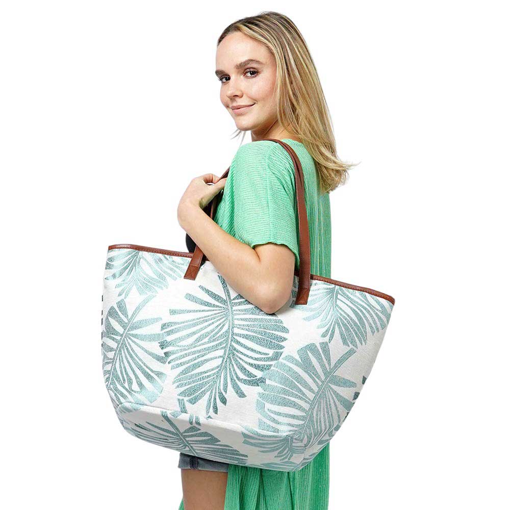Mint Palm Leaves Print Tote Bag, Experience the perfect blend of style and functionality with our tote fag. Crafted with a vibrant palm leaves print, this bag is not only visually appealing but also spacious enough to carry all your essentials. Made of high-quality materials, it ensures durability for your everyday use.