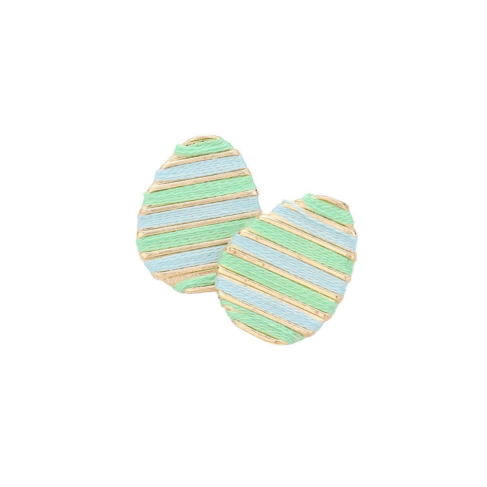 Mint Thread Wrapped Easter Egg Stud Earrings are expertly crafted and offer a unique twist on traditional Easter accessories. The thread wrapping adds texture and depth, making them a beautiful addition to any outfit. Handmade with quality materials, these earrings are sure to become a staple in your jewelry collection.