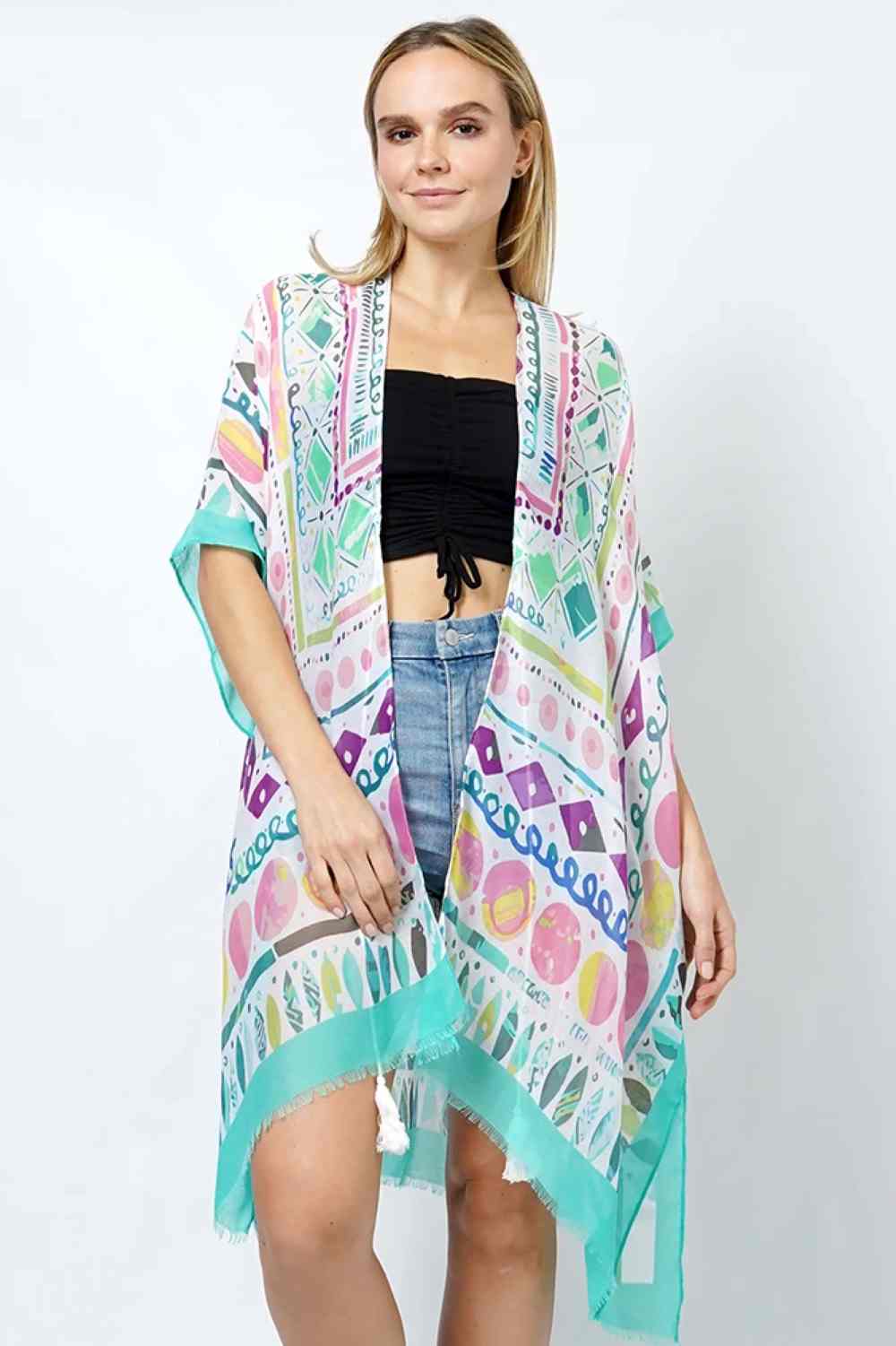 Mint Elevate your wardrobe with this stunning Abstract Print Kimono. Crafted from 100% polyester, this lightweight piece features a bold, artistic design that effortlessly transitions from day to night. With a generous 35" length, it drapes beautifully over any outfit, adding instant sophistication and flair. Perfect for layering or wearing as a statement piece, this versatile kimono is an essential addition to any fashion-forward closet.