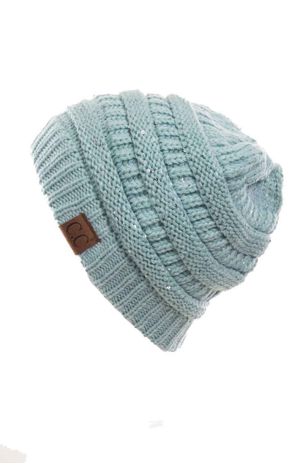 Mint C.C Sequin Ponytail Messy Bun Beanie with open top design lets you pull your hair through for a stylish, effortless look. Crafted from 100% soft acrylic, this cozy beanie keeps you warm while showcasing your ponytail or messy bun. The shimmering sequin detailing adds sparkle and dimension to your winter style. Perfect for casual days, outdoor activities, or layering under jackets. One size fits most for comfortable, versatile wear that works with any outfit.