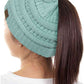 Mint The C.C Solid Color Ponytail Messy Bun Beanie combines comfort with versatility for effortless everyday style. Crafted from 100% soft acrylic, this beanie features an open crown design that accommodates ponytails and messy buns while keeping you warm. The one-size-fits-most construction ensures a secure, flattering fit for virtually anyone. Perfect for casual outings, workouts, or relaxed weekends, this practical accessory transitions seamlessly from season to season.
