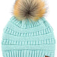 Mint Stay warm and cozy with this classic C.C Pom Pom Knit Beanie, crafted from 100% soft acrylic for all-day comfort. The ribbed knit design adds texture and durability, while the signature pom pom on top brings a playful touch to any winter outfit. One size fits most, making it the perfect accessory for everyone. Ideal for cold weather adventures or casual everyday wear.