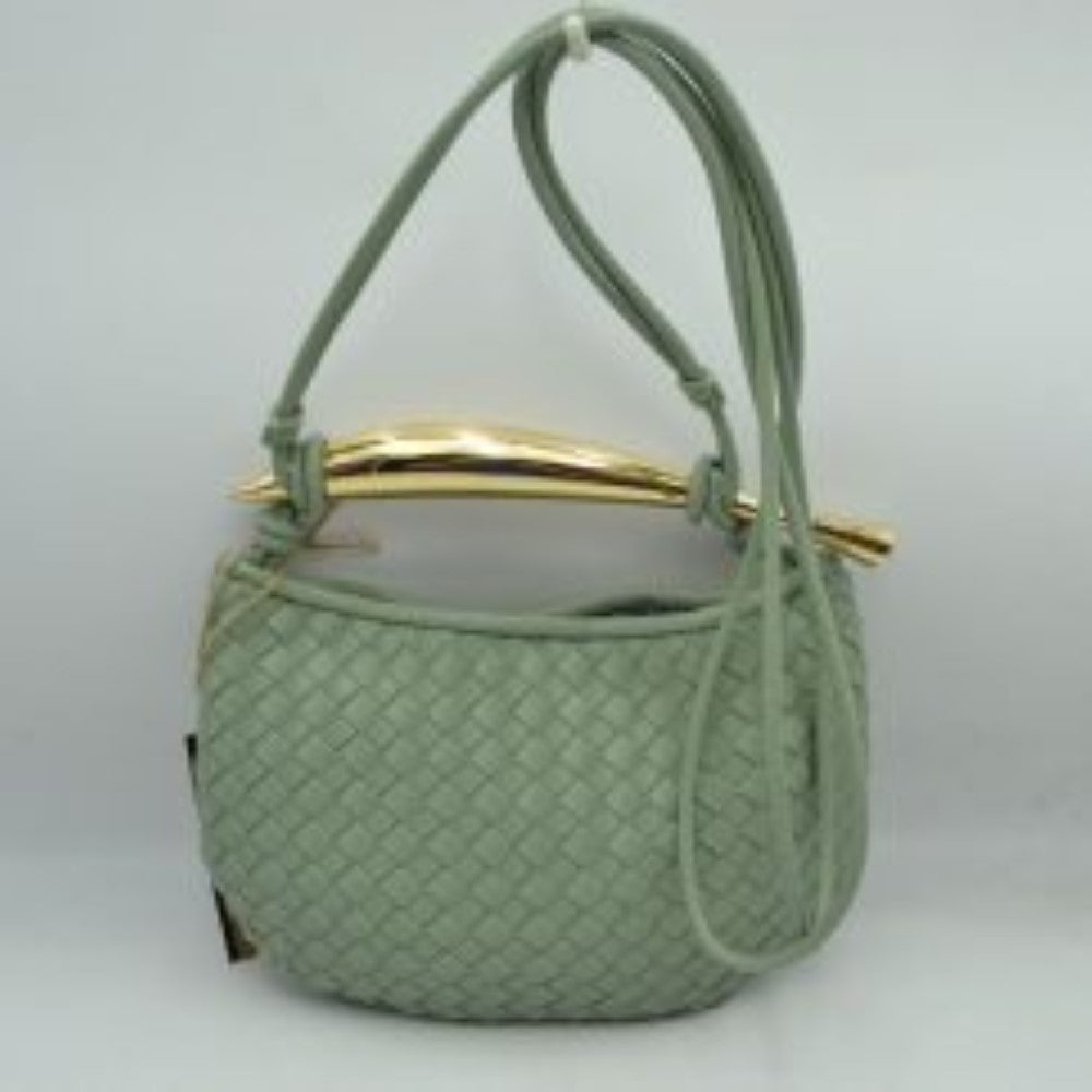 Mint This curved handbag features an intricately textured woven pattern across its exterior body, making it a stylish addition for everyday use. The design is highlighted by a distinctive, polished metallic top handle with tapered ends that anchors the structure. A long, slender matching shoulder strap threads through the top side loops, allowing for easy adjustment and versatile crossbody or shoulder carrying to keep your essentials within reach.