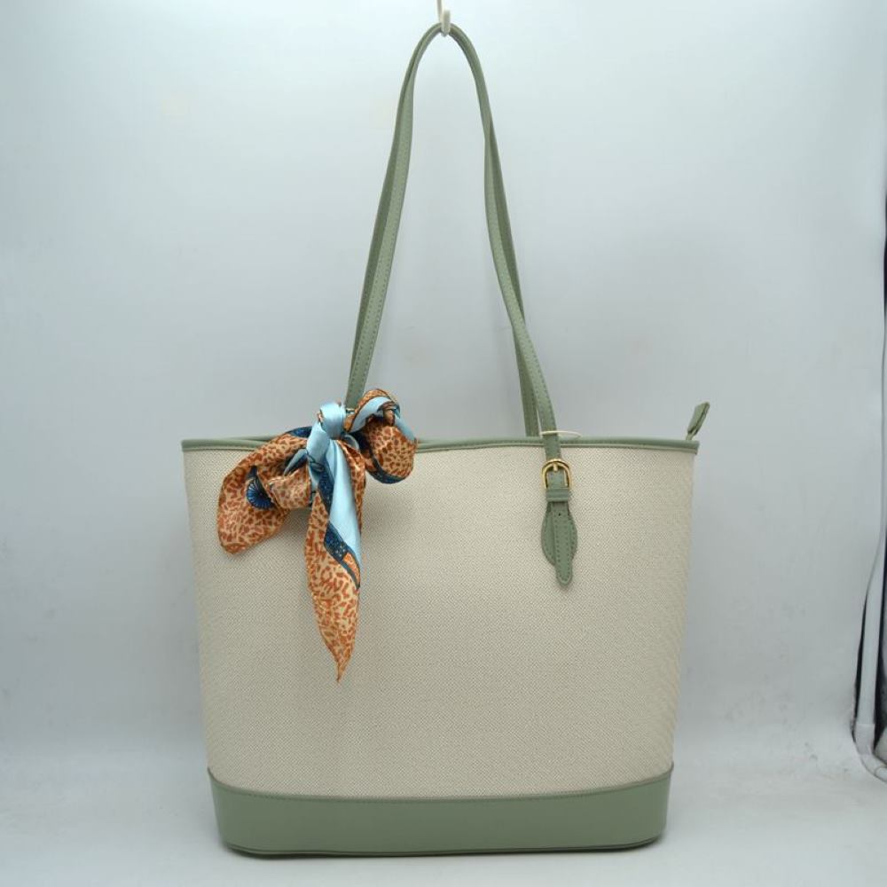 Mint Step out in style with this sophisticated and timeless tote bag. Designed with an understated chevron-style textured weave, this bag seamlessly blends classic elegance with everyday functionality. Perfect for work, travel, or upscale weekend outings, it comes complete with a vibrant, playful silk-style scarf wrapped around the handle for an instant touch of Parisian chic.