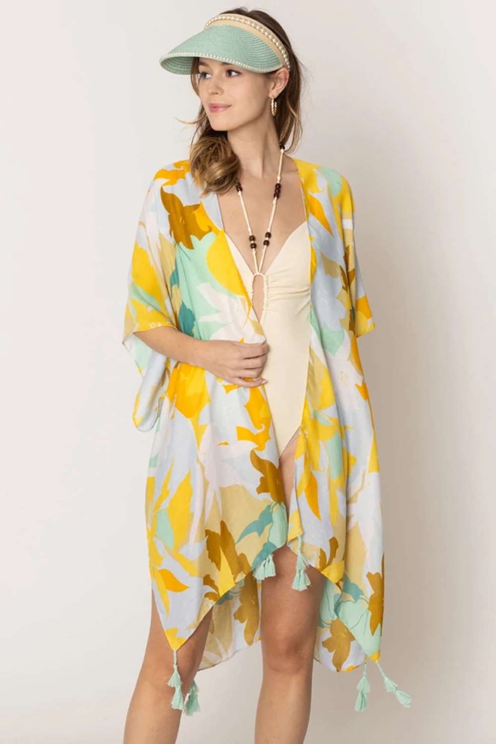 Mint Embrace effortless elegance with this stunning Floral Print Tassel Kimono. Crafted from lightweight 100% polyester, this versatile piece features a beautiful floral design and charming tassel details that add movement and dimension. With generous dimensions of 35.4" x 35.4", it drapes beautifully over any outfit, perfect for layering during warmer months or as a beach cover-up. Whether you're dressing up for a special occasion or keeping it casual, this kimono transitions seamlessly from day to night. 