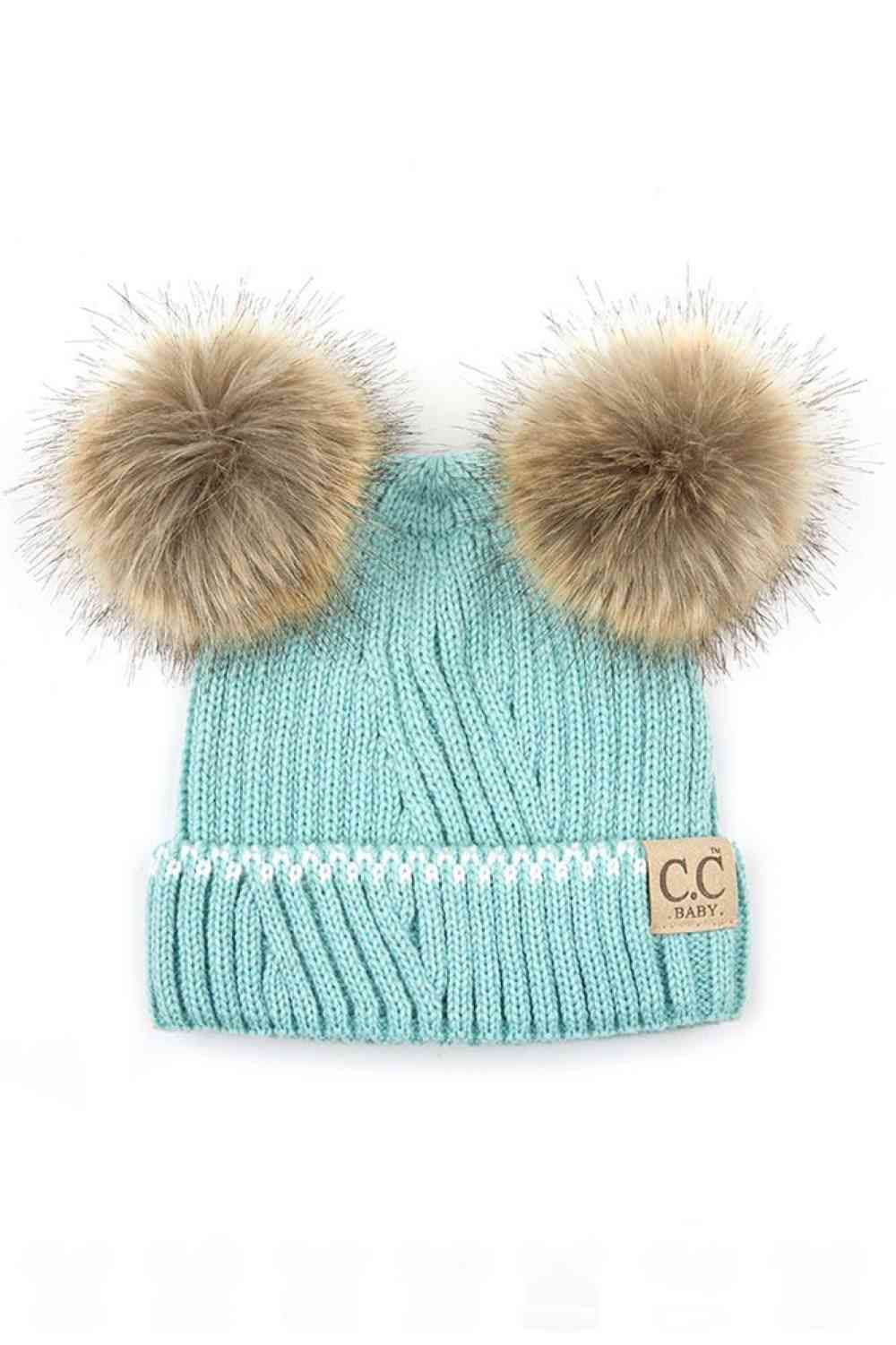 Mint Ivory Wrap your infant in warmth and style with this C.C Solid Knit Double Pom Beanie. Crafted from 100% acrylic, this soft and durable beanie features a classic ribbed knit construction paired with two adorable poms for extra charm. Perfect for keeping tiny heads cozy during cold weather while adding a playful touch to any outfit.