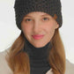 Model Stay warm and stylish with this cozy C.C Cross Cell Stitch Knit Winter Headwrap. Crafted from soft 100% acrylic, this versatile headband features a textured cross cell stitch pattern that adds visual interest to any winter outfit. Measuring 10.25" x 4", it offers a comfortable one-size-fits-most fit perfect for keeping ears and forehead protected during cold weather. Ideal for outdoor activities, casual wear, or layering under hats for extra warmth.