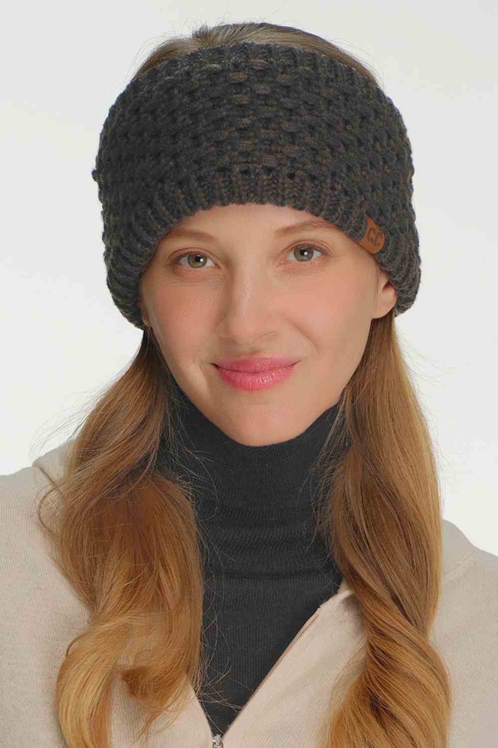 Model Stay warm and stylish with this cozy C.C Cross Cell Stitch Knit Winter Headwrap. Crafted from soft 100% acrylic, this versatile headband features a textured cross cell stitch pattern that adds visual interest to any winter outfit. Measuring 10.25" x 4", it offers a comfortable one-size-fits-most fit perfect for keeping ears and forehead protected during cold weather. Ideal for outdoor activities, casual wear, or layering under hats for extra warmth.