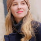 Model Wrap your head in cozy comfort with this charming C.C Flower Pattern Crocheted Headwrap. Featuring an intricate flower design crafted from soft 100% acrylic, this winter headband offers warmth without the bulk. The generous 10" x 4" dimensions provide a perfect fit for one size, making it an easy grab-and-go accessory for chilly days. Whether you're heading out for errands or settling in at home, this versatile headwrap adds a touch of style while keeping you snug and warm.