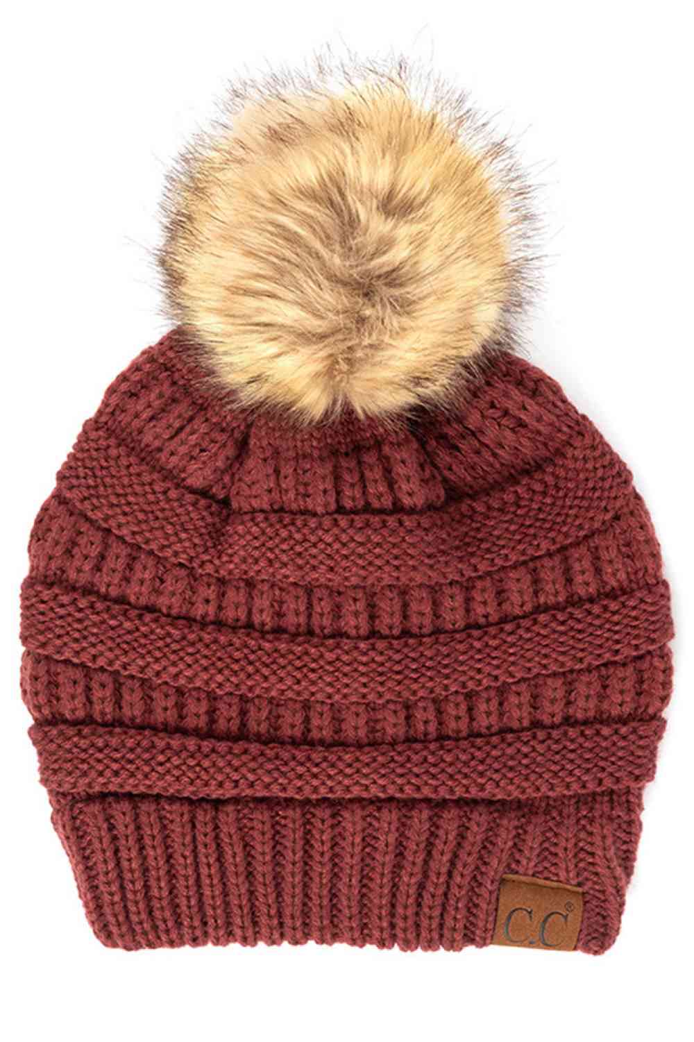 Monaco Stay warm and cozy with this classic C.C Pom Pom Knit Beanie, crafted from 100% soft acrylic for all-day comfort. The ribbed knit design adds texture and durability, while the signature pom pom on top brings a playful touch to any winter outfit. One size fits most, making it the perfect accessory for everyone. Ideal for cold weather adventures or casual everyday wear.