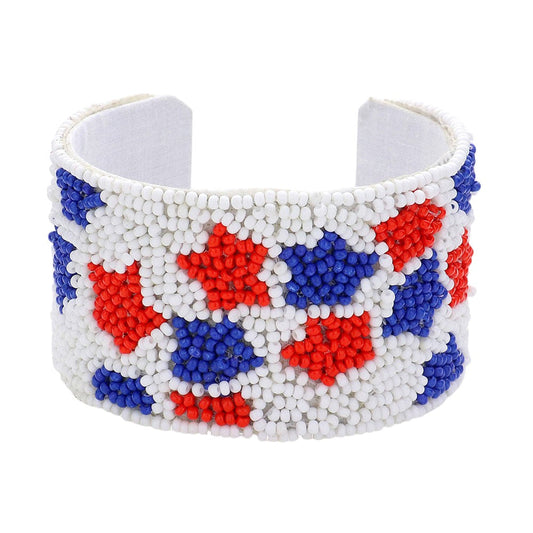 Multi American USA Star Seed Beaded Cuff Bracelet is the perfect patriotic accessory. The intricate seed beading and bold star design make it a stylish addition to any outfit. Show off your American pride with this eye-catching and expertly crafted bracelet.