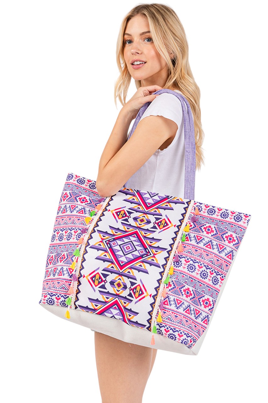 Multi Boho Style Aztec Pattern Tassel Summer Tote Bag combines vibrant cultural design with practical functionality. Featuring a distinctive Aztec pattern and stylish tassels, it offers generous storage for daily essentials or beach gear. Crafted from durable materials, this tote is designed to withstand summer adventures while enhancing your outfit with a unique, artisanal flair. Ideal for those seeking a blend of fashion-forward aesthetics and everyday convenience. 