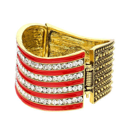Multi Crystal Rhinestone American Flag Hinged Bracelet is both stylish and patriotic. Made with sparkling rhinestones, it adds a touch of glamour to any outfit. The hinged design ensures a comfortable fit, while the American flag design showcases your love for your country. Perfect for any occasion, this bracelet is a must-have for any fashion-forward individual.